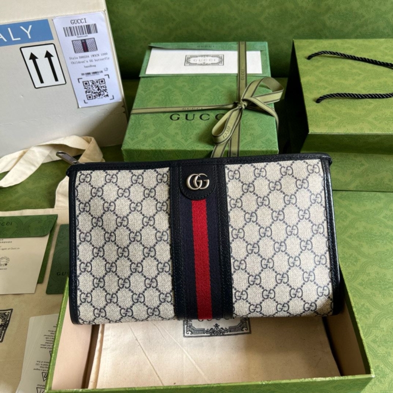 G*u*i clutch bags